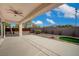 Spacious covered patio with a ceiling fan overlooking the landscaped backyard at 2603 Savannah Springs Ave, Henderson, NV 89052