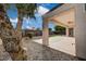 Backyard featuring landscaping and a covered patio with an outdoor fan at 2603 Savannah Springs Ave, Henderson, NV 89052