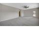 Spacious bedroom features neutral colors, modern ceiling fan, and outdoor access at 2603 Savannah Springs Ave, Henderson, NV 89052