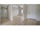 Inviting entryway with light wood floors and open view to the Gathering room and front door at 2603 Savannah Springs Ave, Henderson, NV 89052