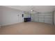 Spacious garage with epoxy flooring and an automatic garage door with overhead storage at 2603 Savannah Springs Ave, Henderson, NV 89052