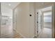 Hallway featuring modern plank floors with an open kitchen and living area nearby at 2603 Savannah Springs Ave, Henderson, NV 89052