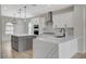 Modern kitchen features quartz countertops, stainless steel appliances, and a stylish center island at 2603 Savannah Springs Ave, Henderson, NV 89052