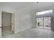 Bright bedroom with tile flooring and a sliding glass door to the backyard at 2716 Ferrin Rd, Las Vegas, NV 89117