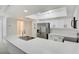 A bright kitchen featuring stainless steel appliances, white cabinets, and a skylight at 2716 Ferrin Rd, Las Vegas, NV 89117