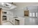 Bright, modern kitchen featuring stainless steel appliances and white countertops at 2716 Ferrin Rd, Las Vegas, NV 89117