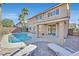 Inviting backyard with a private pool, patio area, and mature palm trees at 3065 Lenoir St, Las Vegas, NV 89135