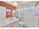 Bright bathroom featuring a glass-enclosed shower, modern sink, and a neutral color palette at 3065 Lenoir St, Las Vegas, NV 89135