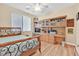 A cozy bedroom featuring a wooden bed frame and built-in desk with ample storage at 3065 Lenoir St, Las Vegas, NV 89135