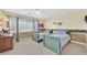 Bedroom with two twin beds, a ceiling fan, and a large window at 3065 Lenoir St, Las Vegas, NV 89135
