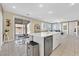 Bright kitchen with a center island, stainless steel appliances, and outdoor access at 3065 Lenoir St, Las Vegas, NV 89135