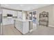 Modern kitchen with stainless steel appliances, a center island, and tile flooring at 3065 Lenoir St, Las Vegas, NV 89135