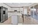 Modern kitchen features white cabinetry, stainless steel appliances, and a center island at 3065 Lenoir St, Las Vegas, NV 89135