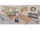 Cozy living room featuring hardwood floors and a seamless connection to the dining area at 3065 Lenoir St, Las Vegas, NV 89135