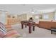 Open loft space with foosball table, comfortable seating, and staircase access at 3065 Lenoir St, Las Vegas, NV 89135