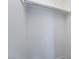 A standard-sized closet featuring a sturdy, silver metal hanging rod, perfect for organizing clothes at 3141 Pinehurst Dr # C, Las Vegas, NV 89109