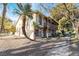 Charming two-story home featuring a balcony, desert landscaping and a sidewalk leading to the front door at 3141 Pinehurst Dr # C, Las Vegas, NV 89109