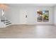 An airy living space featuring light wood floors, staircase and sunlit window at 3141 Pinehurst Dr # C, Las Vegas, NV 89109
