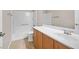 Bathroom featuring a shower and bath combo, a modern vanity, and tile floors at 33 Gentilly Lace Ave, Henderson, NV 89002