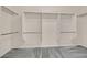 Walk-in closet with built-in shelving and carpeted floor, offering ample storage at 33 Gentilly Lace Ave, Henderson, NV 89002