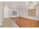 Open-concept living room filled with natural light showcasing beautiful hardwood floors and neutral paint at 33 Gentilly Lace Ave, Henderson, NV 89002