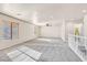 Bright, open living space features neutral walls, plush gray carpet, and natural light from two large windows at 33 Gentilly Lace Ave, Henderson, NV 89002