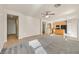 Open-concept living space provides an easy flow between the kitchen and living room with neutral walls at 33 Gentilly Lace Ave, Henderson, NV 89002