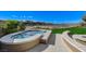 Outdoor spa features a custom stone design and gorgeous golf course views at 33 Hassayampa Trl, Henderson, NV 89052