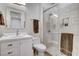 Modern bathroom featuring a glass-enclosed shower, a white vanity, and contemporary fixtures offering comfort and style at 33 Hassayampa Trl, Henderson, NV 89052
