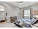 Inviting bedroom featuring a patterned quilt bed, natural light, and ensuite access, promoting relaxation at 33 Hassayampa Trl, Henderson, NV 89052