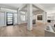 Welcoming entryway with wood-look tile, a modern door, and an open view of the living space at 33 Hassayampa Trl, Henderson, NV 89052