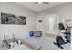 An exercise room equipped with modern machines and decorated with a beautiful mountain scene at 33 Hassayampa Trl, Henderson, NV 89052