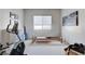 Bright exercise room with modern equipment, white walls, and a large window at 33 Hassayampa Trl, Henderson, NV 89052