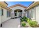 Welcoming front entrance with modern glass door and manicured landscaping at 33 Hassayampa Trl, Henderson, NV 89052