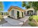 Beautiful walkway to front door with lush landscaping and modern architectural details at 33 Hassayampa Trl, Henderson, NV 89052
