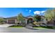Charming single-story home with lush landscaping, stone accents, and a well-manicured lawn at 33 Hassayampa Trl, Henderson, NV 89052
