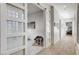 Bright hallway showcasing decorative doors and access to exercise room and other parts of the house at 33 Hassayampa Trl, Henderson, NV 89052