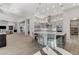 Spacious kitchen with seating at the island overlooking the open floor plan of the living and dining areas at 33 Hassayampa Trl, Henderson, NV 89052