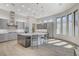 Spacious kitchen with granite countertops, stainless appliances, tile backsplash, and center island with seating at 33 Hassayampa Trl, Henderson, NV 89052