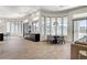 Open-concept living area with wood floors, modern bar, and dining space, perfect for entertaining at 33 Hassayampa Trl, Henderson, NV 89052
