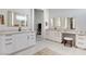 Spacious bathroom with dual sinks, well-lit mirrors, soaking tub and contemporary fixtures at 33 Hassayampa Trl, Henderson, NV 89052