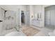 Bright bathroom with walk-in shower, soaking tub, and and sinks at 33 Hassayampa Trl, Henderson, NV 89052