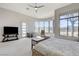 Spacious main bedroom offering plentiful natural light, contemporary furnishings, and backyard view at 33 Hassayampa Trl, Henderson, NV 89052