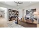 Spacious home office featuring a large desk, shelving with books, and modern décor, creating an ideal work environment at 33 Hassayampa Trl, Henderson, NV 89052