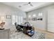 Well-lit home office with large window, traditional desk, and modern decor, perfect for a productive workspace at 33 Hassayampa Trl, Henderson, NV 89052