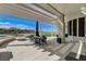 Covered outdoor patio features a fire pit, seating and views at 33 Hassayampa Trl, Henderson, NV 89052