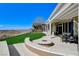 A luxurious outdoor space with a fire pit and golf course views at 33 Hassayampa Trl, Henderson, NV 89052