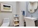 Stylish powder room with a unique pedestal sink, decorative tile, and elegant fixtures at 33 Hassayampa Trl, Henderson, NV 89052