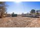 A partially fenced backyard with a storage shed offers space and security at 352 Cox Ave, Overton, NV 89040