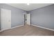 This bedroom features gray walls, light wood floors, and white doors at 352 Cox Ave, Overton, NV 89040